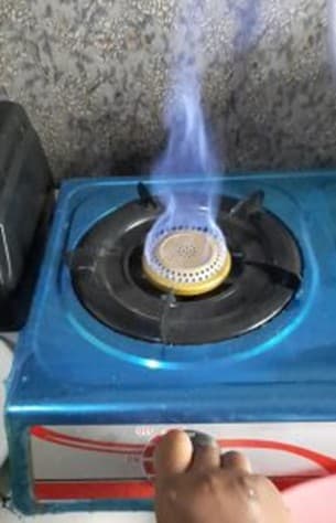 Blue flame on a biogas cooking stove